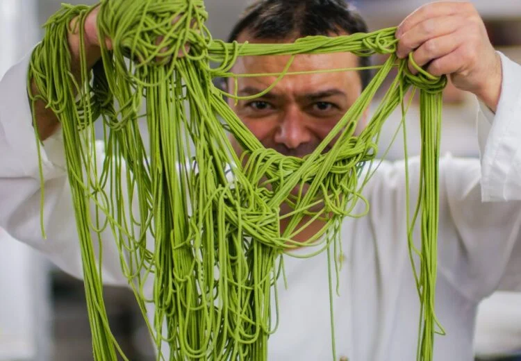 Chef Baldo preparing Italian cuisine in London kitchen